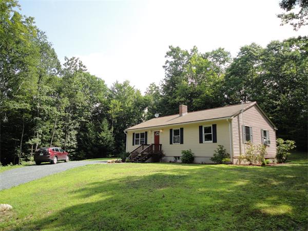 253 NW Road Westhampton, MA 01027 - Photo 1 of 16 a view of a house with backyard and garden