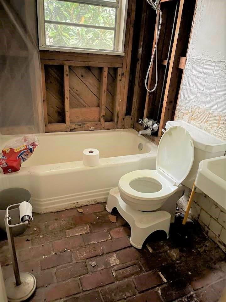 700 New Market Road Tryon, NC 28782 - Photo 16 of 44 a bathroom with a sink a toilet and a mirror
