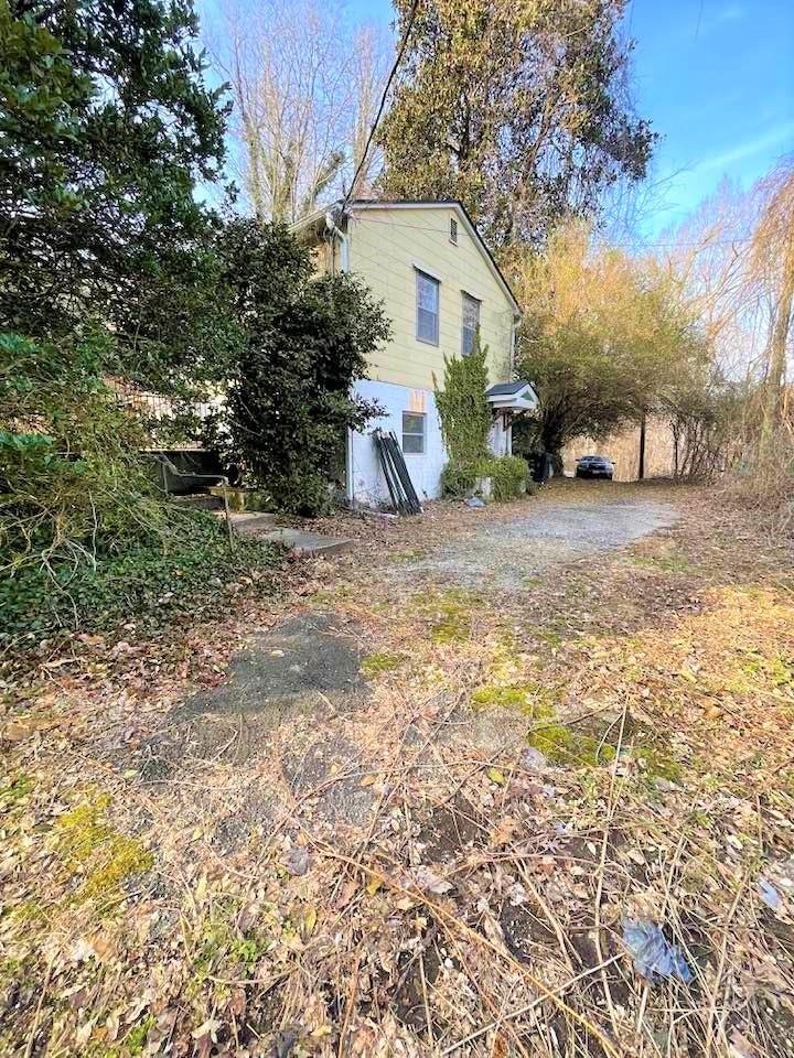 700 New Market Road Tryon, NC 28782 - Photo 2 of 44 a view of a house with a yard
