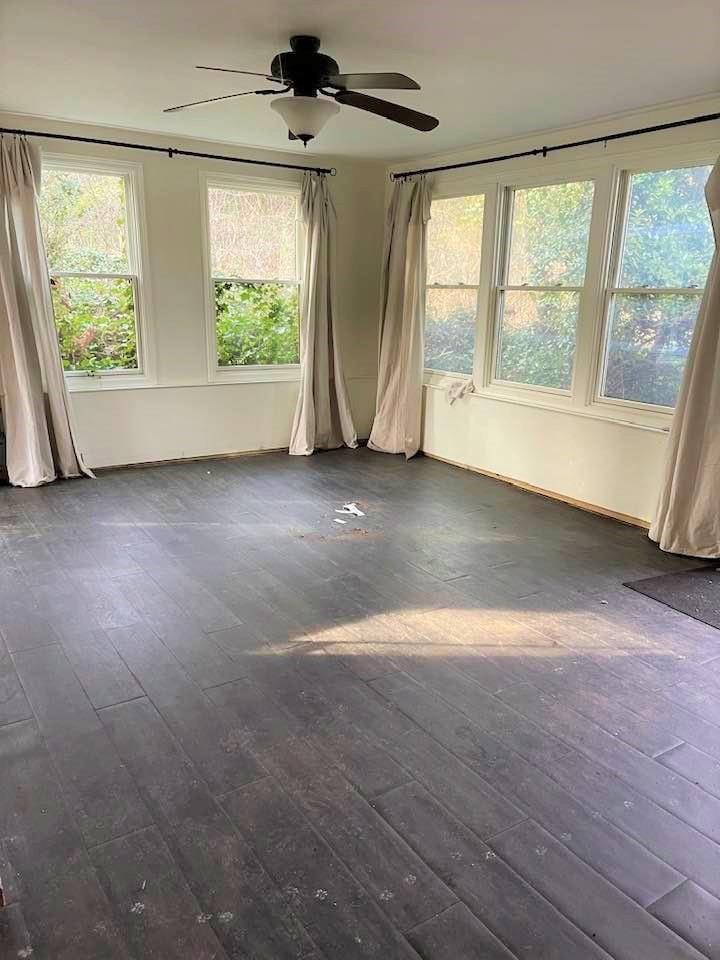 700 New Market Road Tryon, NC 28782 - Photo 8 of 44 an empty room with wooden floor and windows