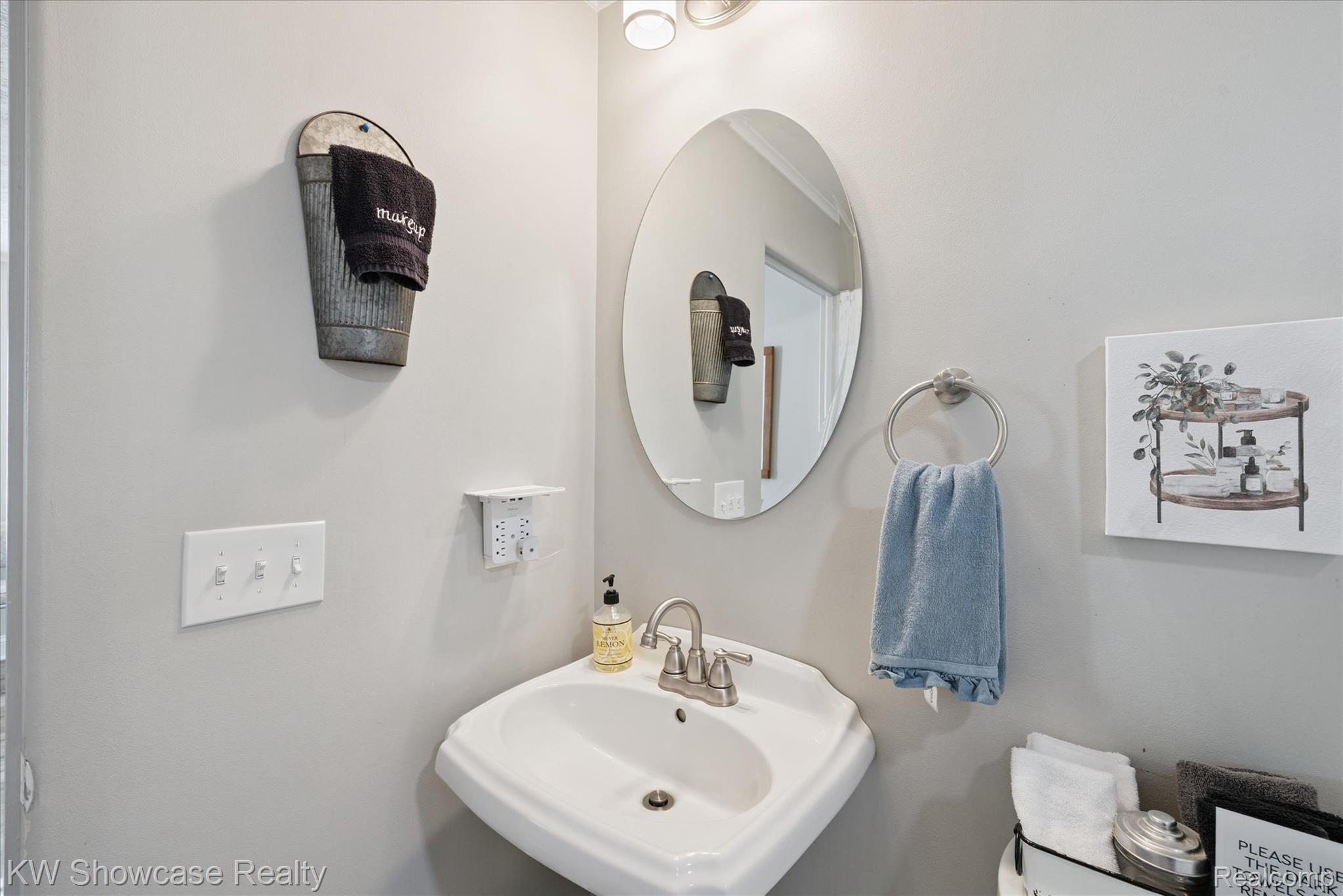 603 West Clinton Street Howell, MI 48843 - Photo 17 of 25 Half bathroom featuring a sink