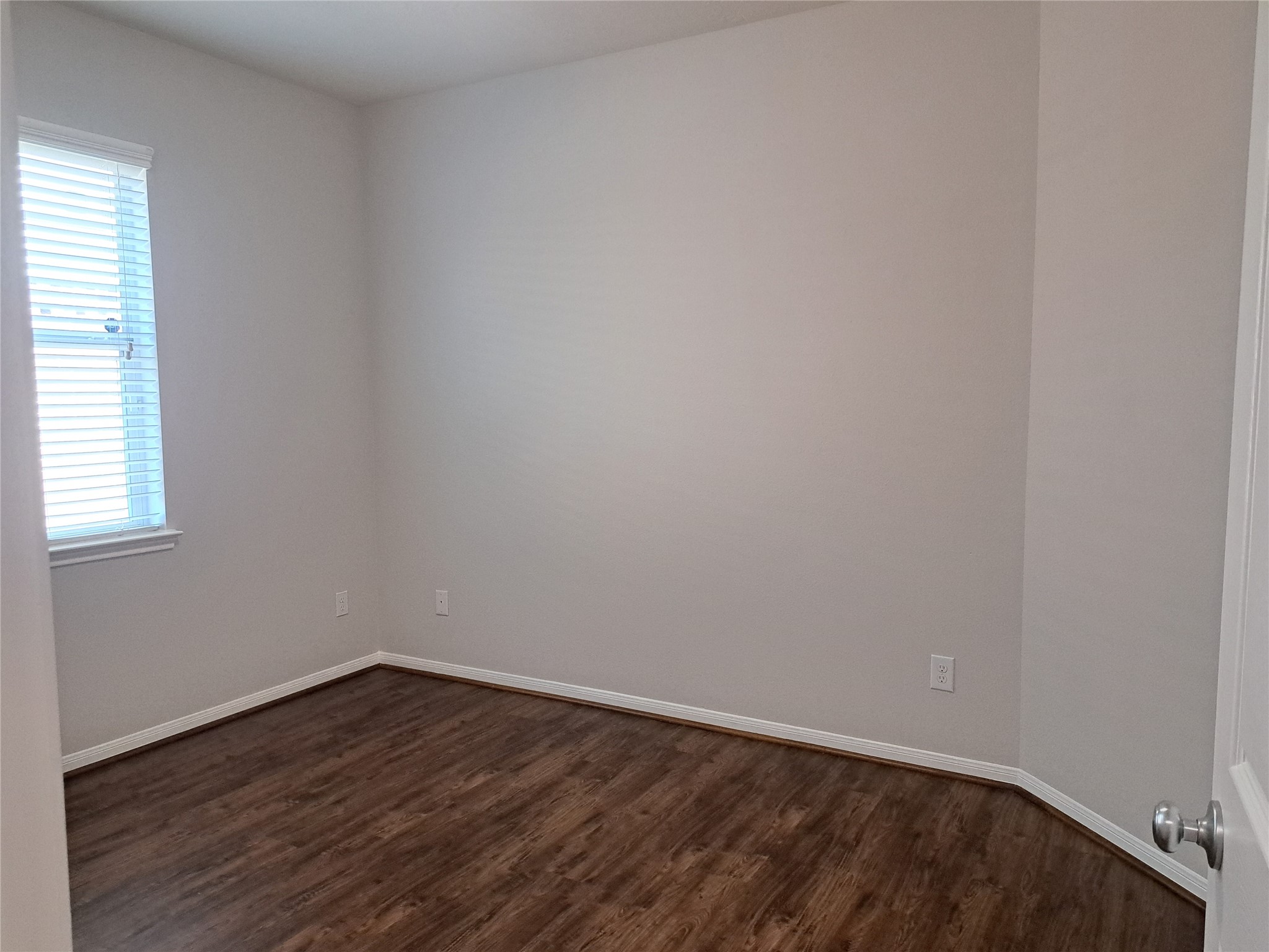 26315 Fox Ridge Lane Katy, TX 77494 - Photo 34 of 39 a view of an empty room with wooden floor and a window