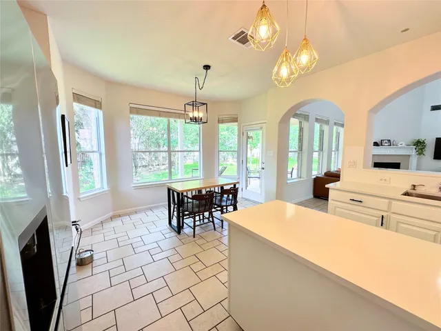 a outdoor space with the couches and dining table in it