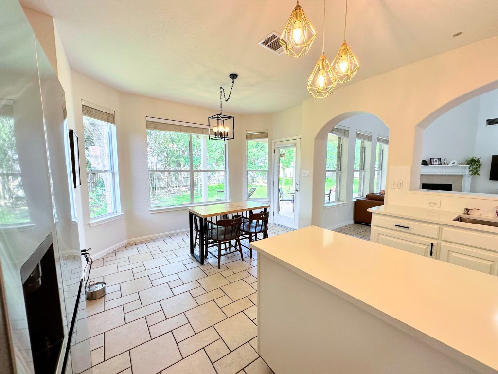 12504 Gun Metal Drive Austin, TX 78739 - Photo 13 of 40 a outdoor space with the couches and dining table in it