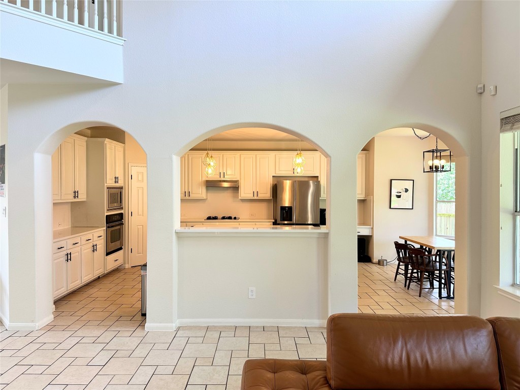 12504 Gun Metal Drive Austin, TX 78739 - Photo 14 of 40 a living room with furniture and a large window