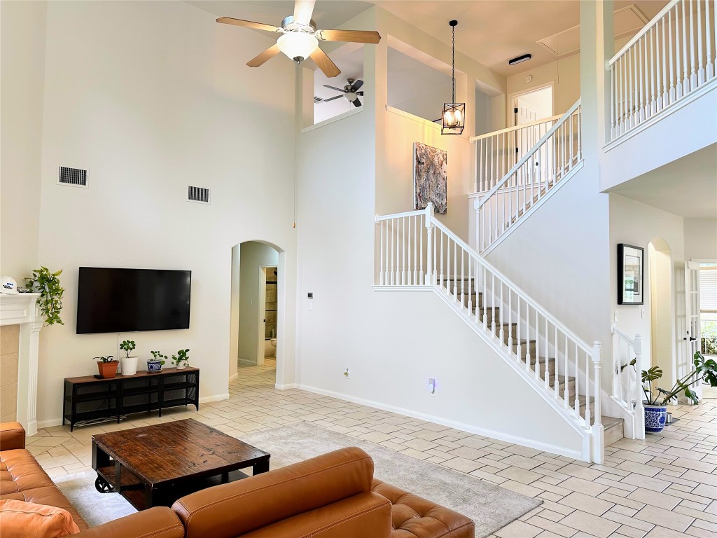 12504 Gun Metal Drive Austin, TX 78739 - Photo 15 of 40 a living room with furniture and a flat screen tv