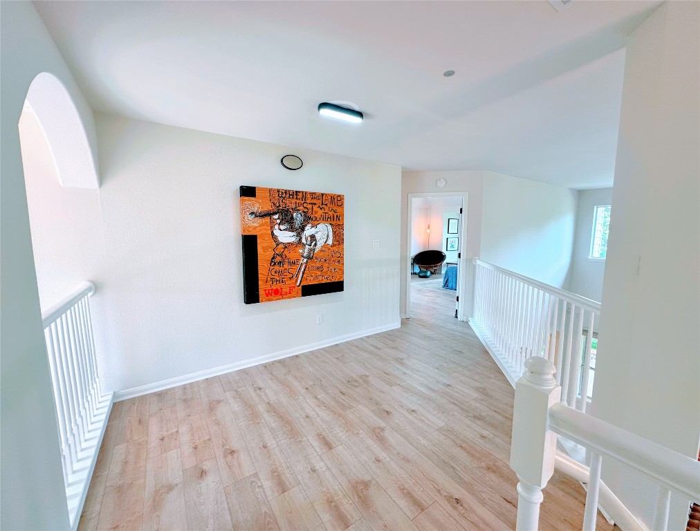 12504 Gun Metal Drive Austin, TX 78739 - Photo 19 of 40 wooden floor in a hall with an entryway