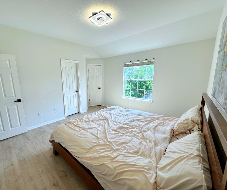 12504 Gun Metal Drive Austin, TX 78739 - Photo 25 of 40 a bedroom with a bed and a window