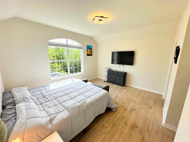 a bathroom with a granite countertop toilet and a shower