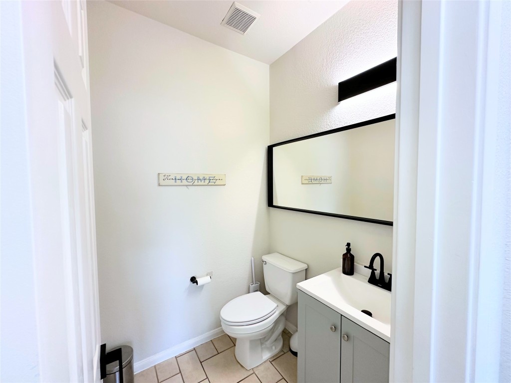 12504 Gun Metal Drive Austin, TX 78739 - Photo 8 of 40 a bathroom with a toilet sink and mirror