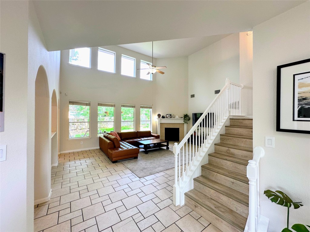 12504 Gun Metal Drive Austin, TX 78739 - Photo 10 of 40 a living room with furniture and stairs