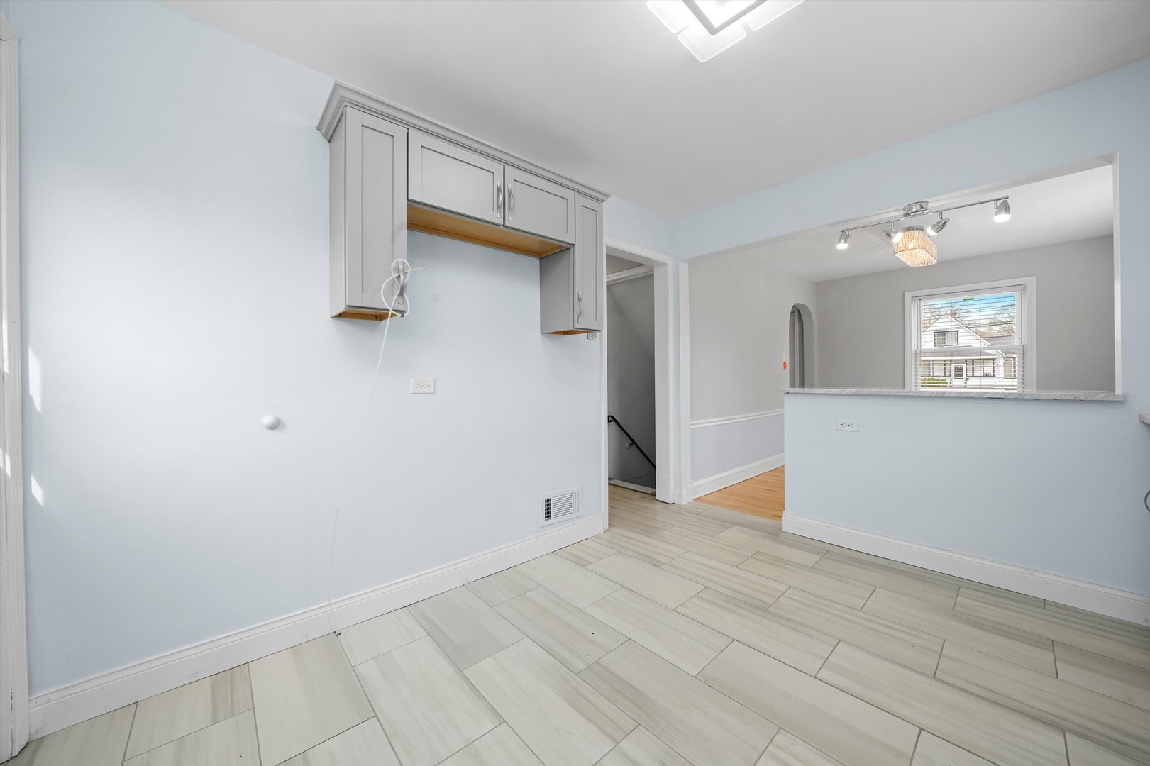 1643 183rd Street Homewood, IL 60430 - Photo 11 of 44 a view of an empty room with wooden floor and a window