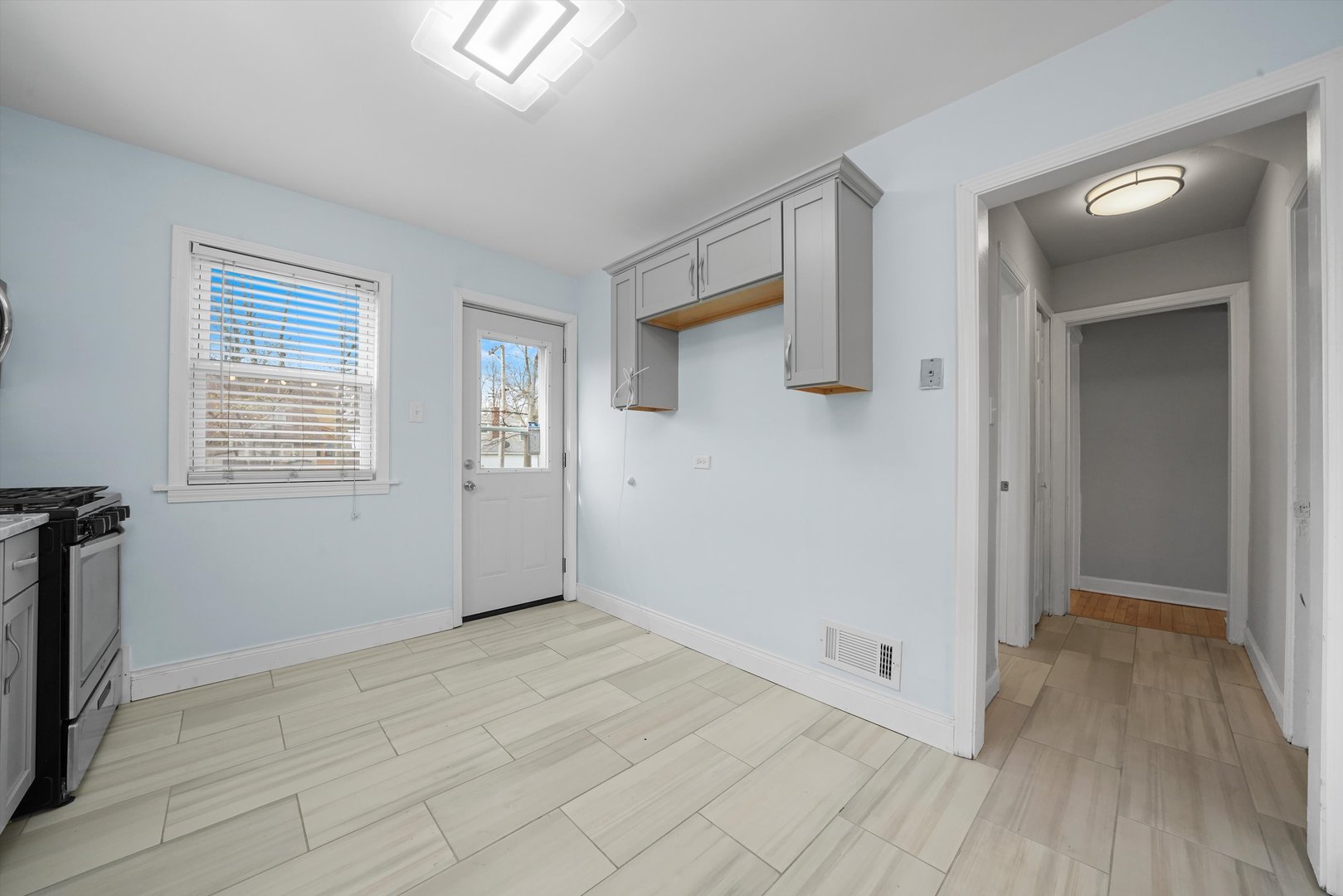 1643 183rd Street Homewood, IL 60430 - Photo 12 of 44 a view of an empty room with wooden floor and a window