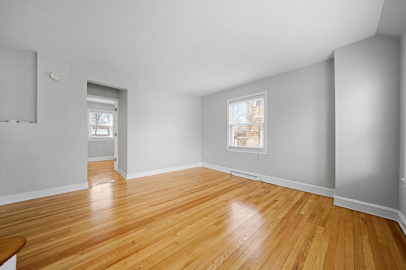 1643 183rd Street Homewood, IL 60430 - Photo 14 of 44 a view of an empty room with wooden floor and window