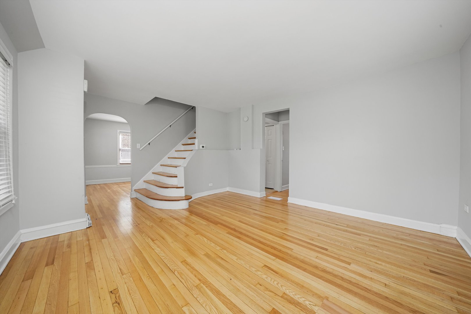 1643 183rd Street Homewood, IL 60430 - Photo 15 of 44 a view of an empty room with wooden floor and stairs