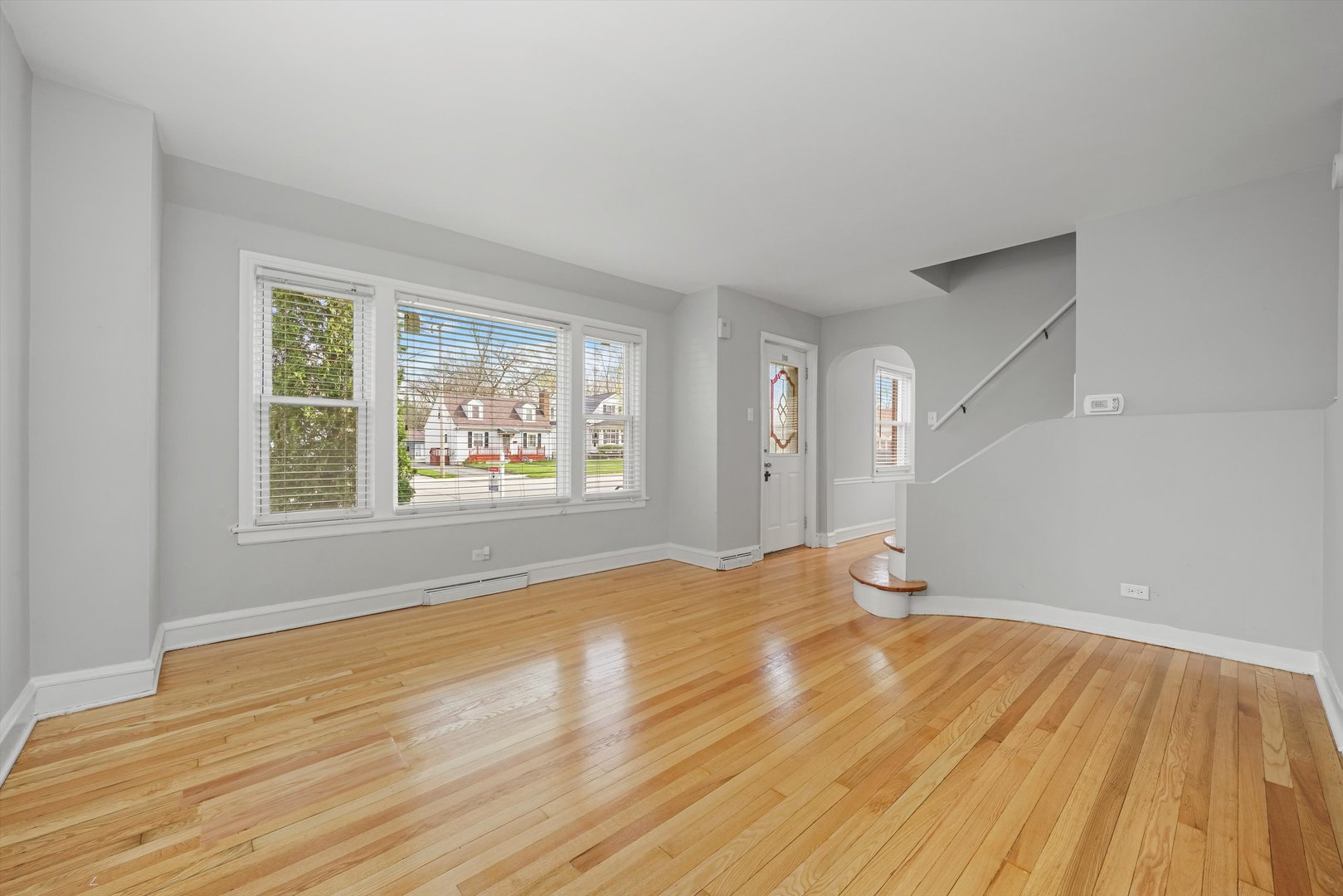 1643 183rd Street Homewood, IL 60430 - Photo 17 of 44 a view of empty room with wooden floor and fan