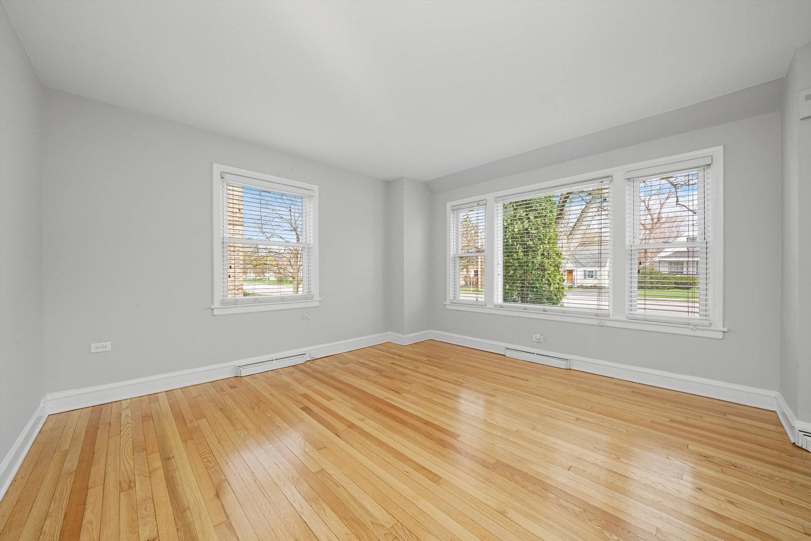 1643 183rd Street Homewood, IL 60430 - Photo 18 of 44 a view of an empty room with wooden floor and a window