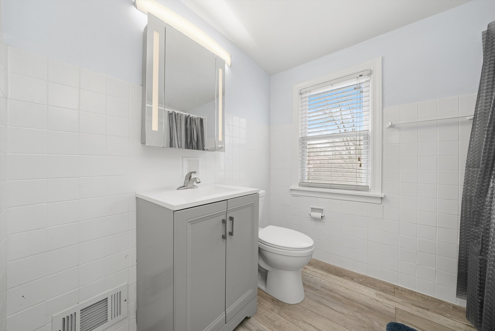 1643 183rd Street Homewood, IL 60430 - Photo 19 of 44 a bathroom with a sink toilet and mirror