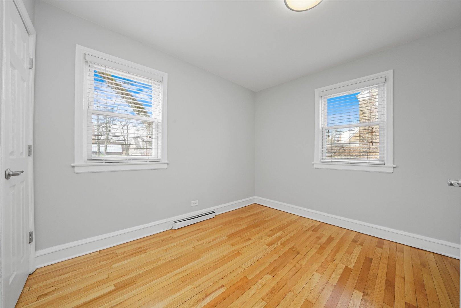 1643 183rd Street Homewood, IL 60430 - Photo 20 of 44 a view of an empty room with wooden floor and a window