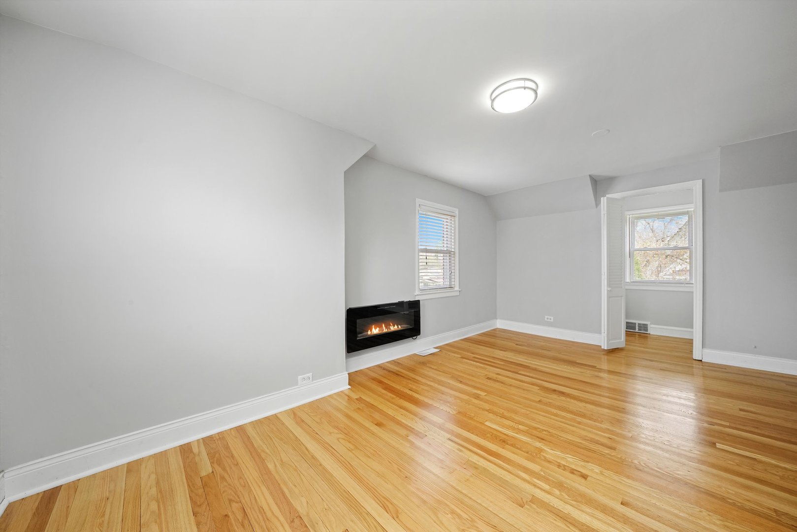 1643 183rd Street Homewood, IL 60430 - Photo 23 of 44 a view of empty room with wooden floor and fireplace