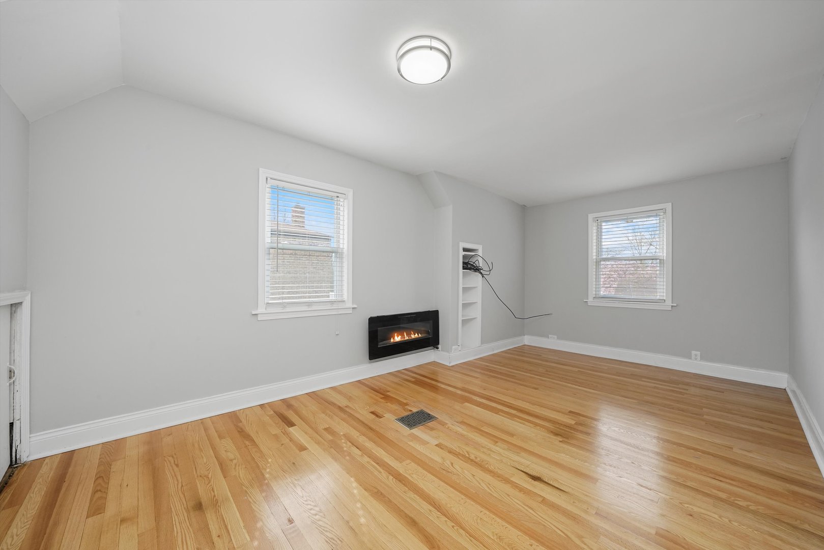 1643 183rd Street Homewood, IL 60430 - Photo 26 of 44 a view of empty room with wooden floor and fireplace