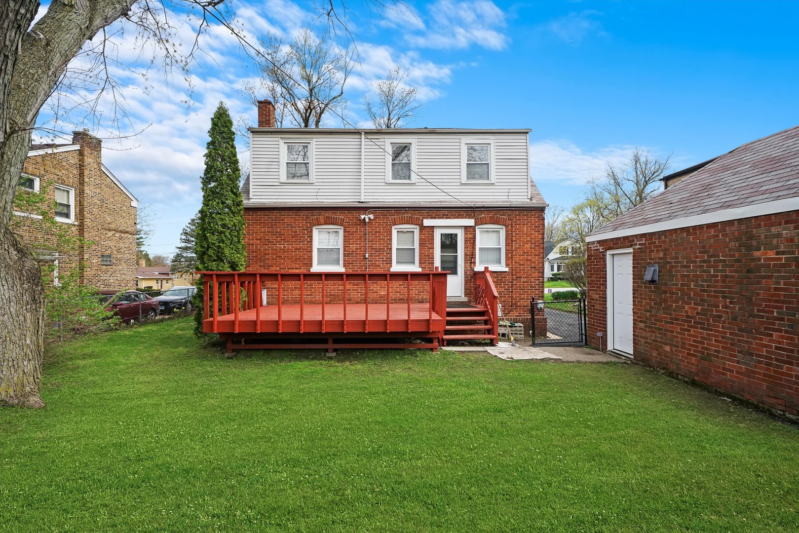 1643 183rd Street Homewood, IL 60430 - Photo 34 of 44 a view of a house with a yard and deck