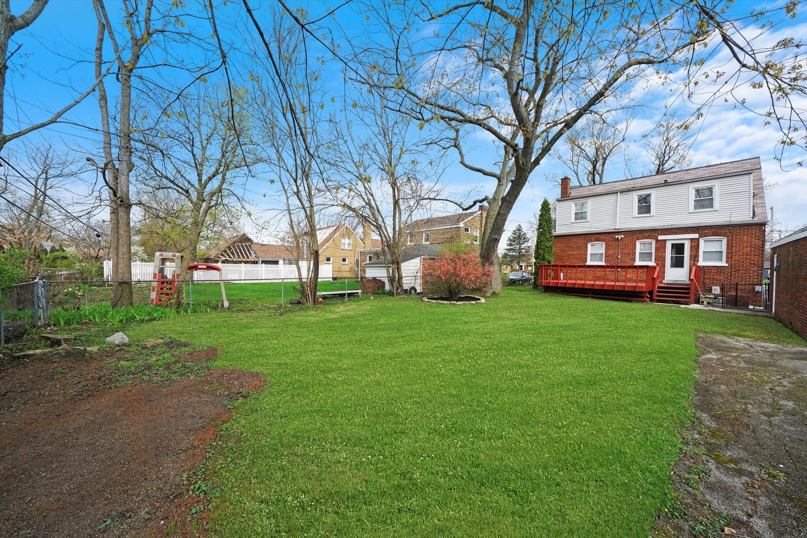 1643 183rd Street Homewood, IL 60430 - Photo 35 of 44 a front view of a house with a garden and trees