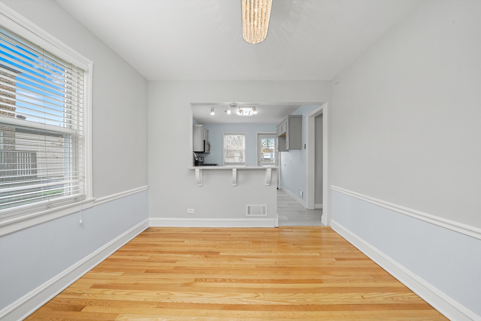 1643 183rd Street Homewood, IL 60430 - Photo 6 of 44 a view of a room with wooden floor and a window