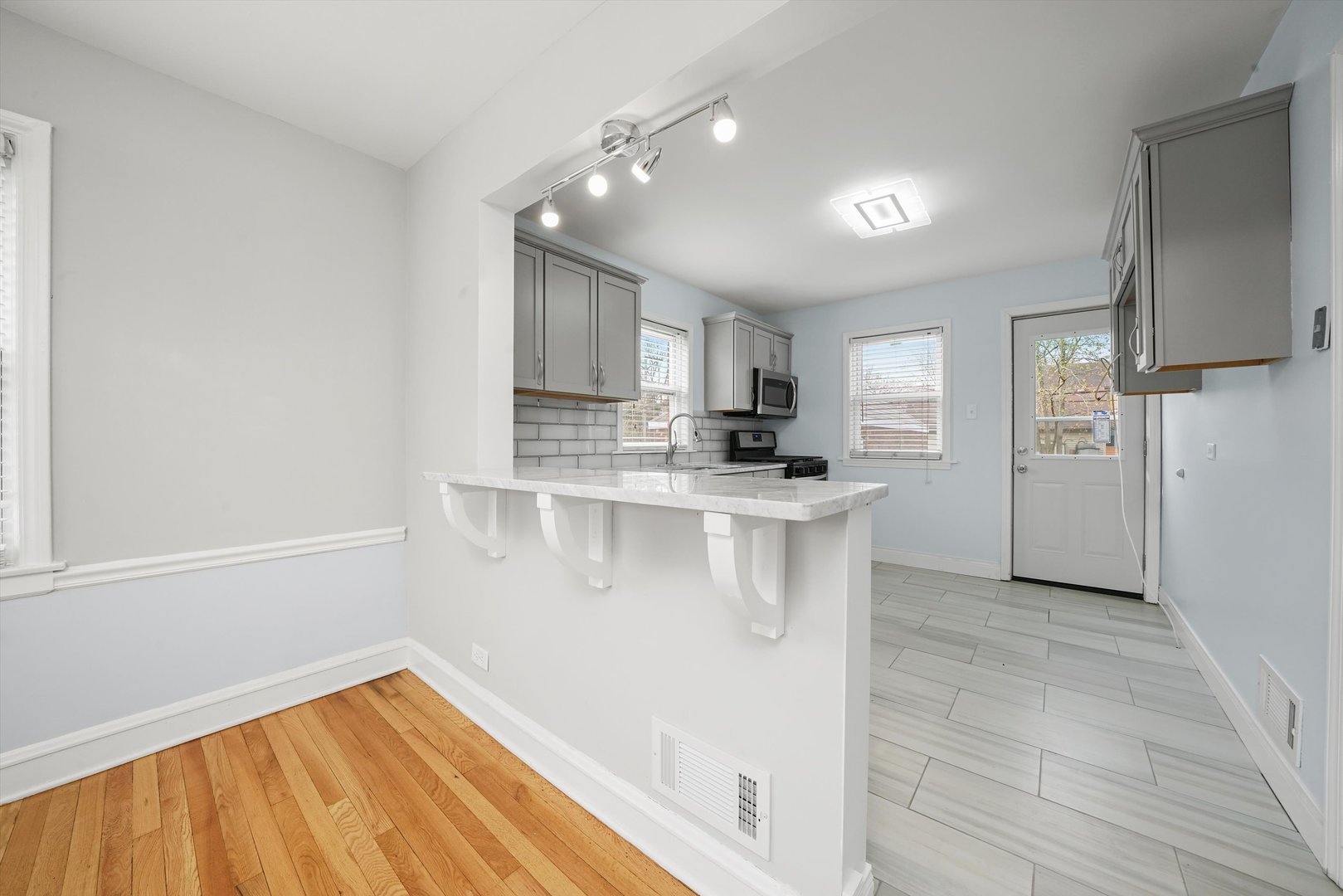 1643 183rd Street Homewood, IL 60430 - Photo 7 of 44 a kitchen with a refrigerator and a sink