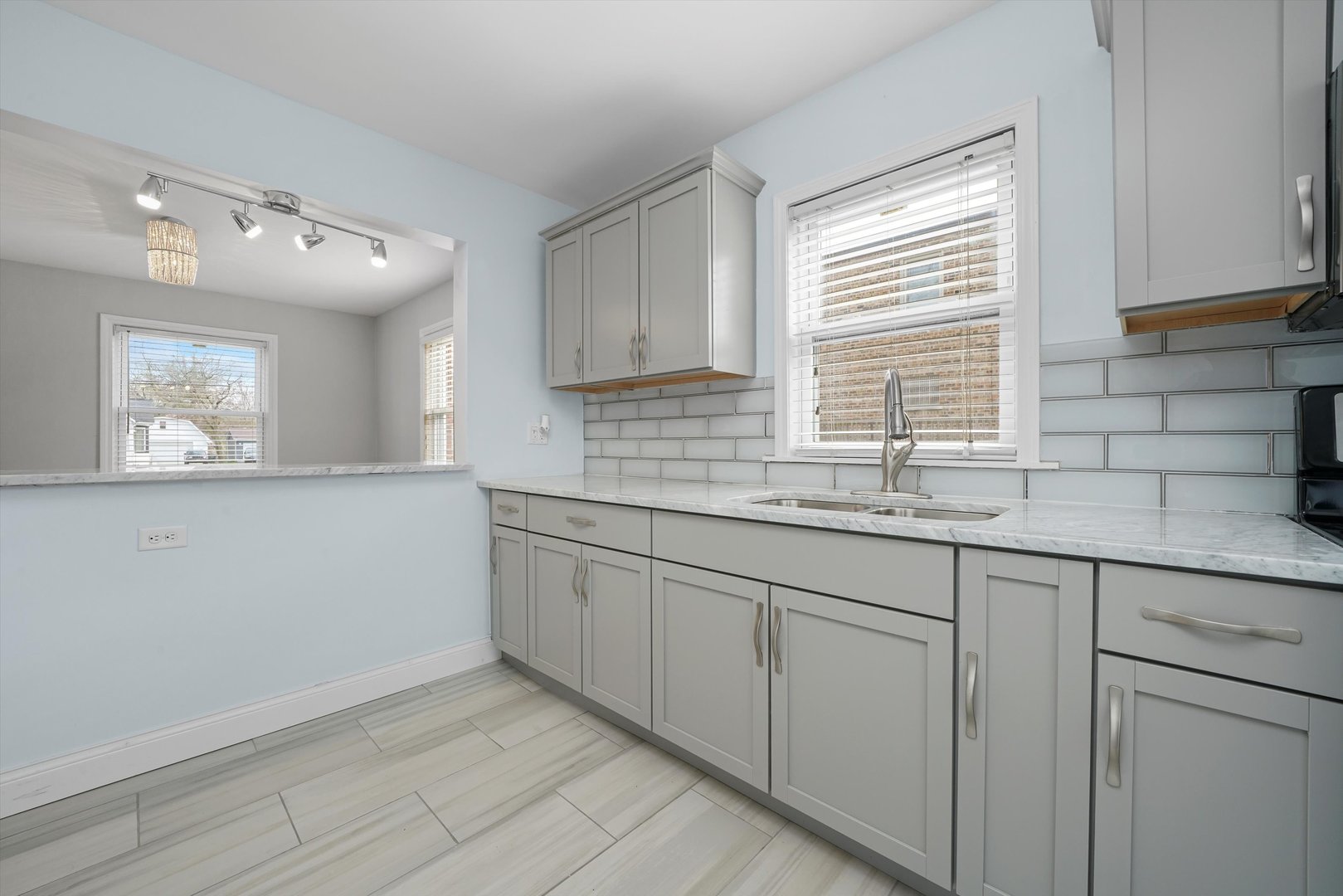 1643 183rd Street Homewood, IL 60430 - Photo 10 of 44 a kitchen with granite countertop white cabinets and a window