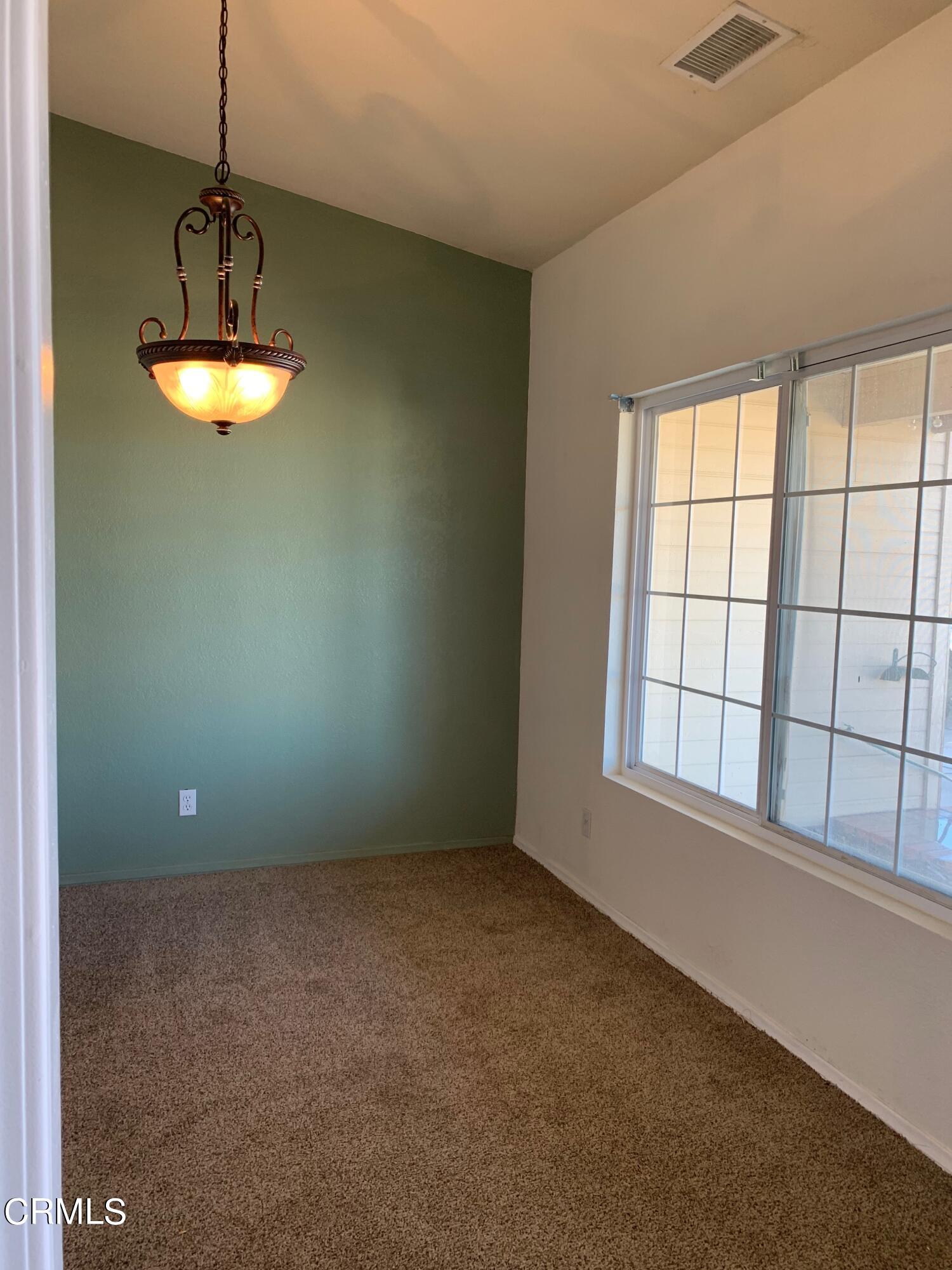 22159 Tehama Road Apple Valley, CA 92308 - Photo 14 of 26 a view of an empty room with a window