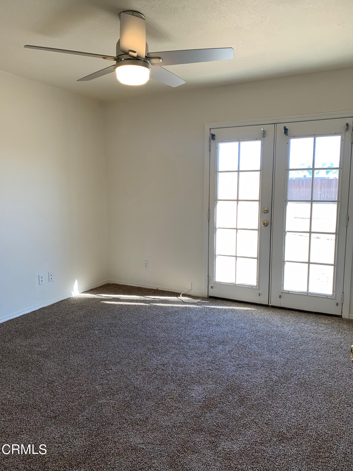 22159 Tehama Road Apple Valley, CA 92308 - Photo 15 of 26 an empty room with a empty space and windows