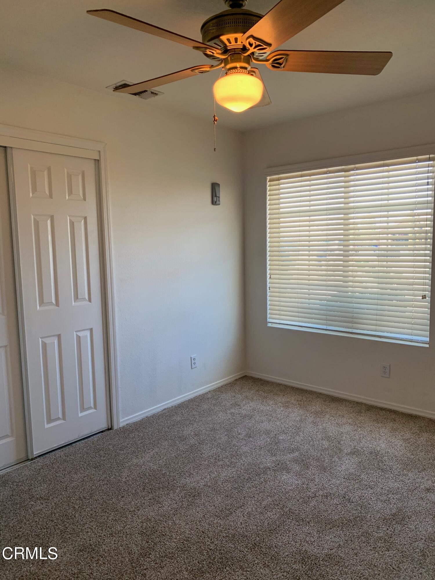 22159 Tehama Road Apple Valley, CA 92308 - Photo 20 of 26 a view of an empty room with a window