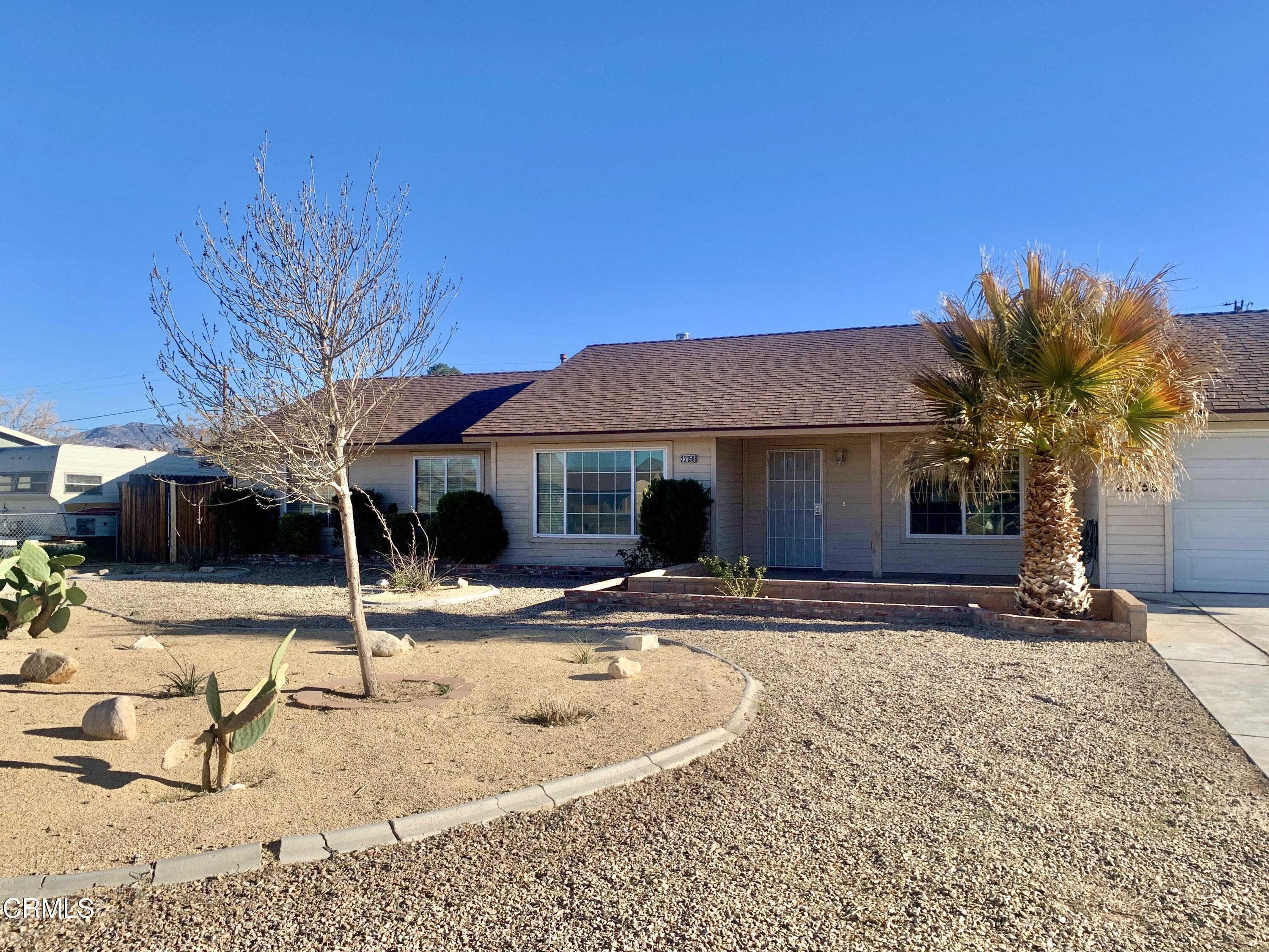 22159 Tehama Road Apple Valley, CA 92308 - Photo 2 of 26 a view of a house with snow on the floor