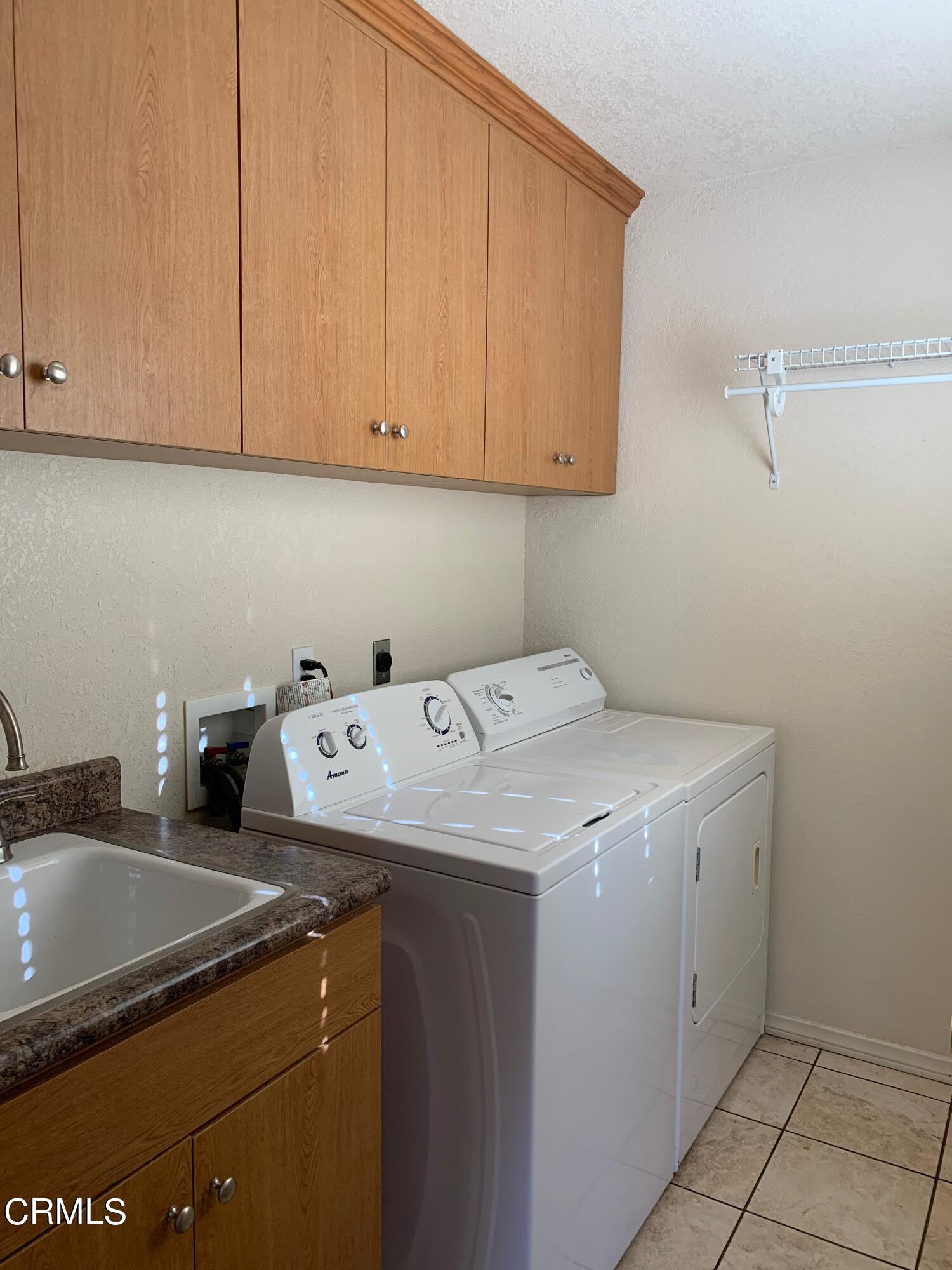 22159 Tehama Road Apple Valley, CA 92308 - Photo 26 of 26 a utility room with dryer and washer