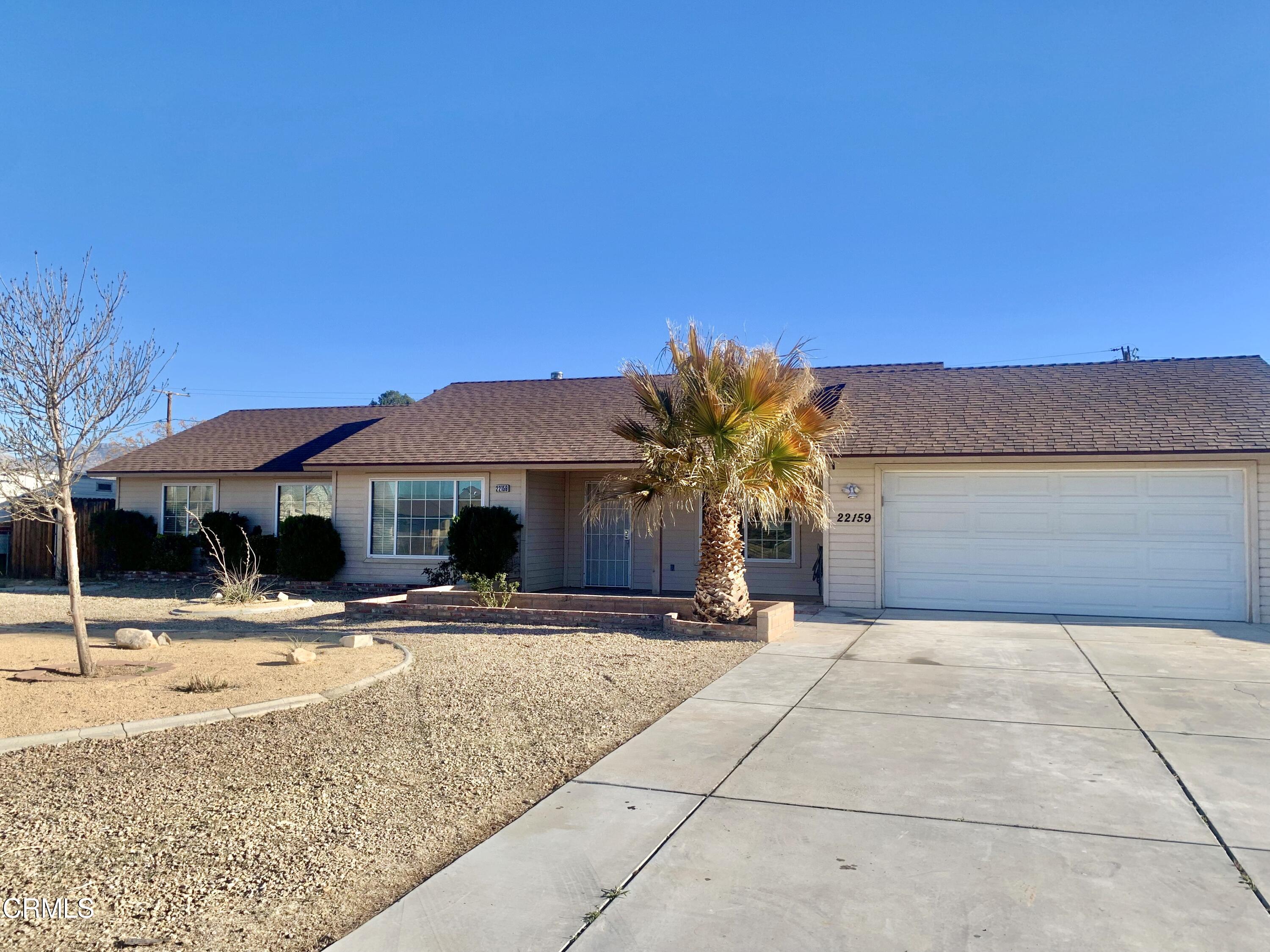 22159 Tehama Road Apple Valley, CA 92308 - Photo 3 of 26 a front view of house with yard