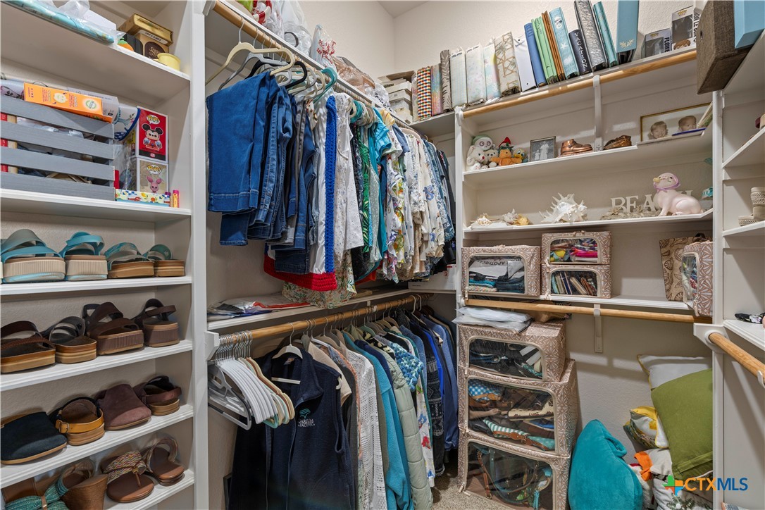2649 Bowles Ranch Road Belton, TX 76513 - Photo 20 of 36 a view of walk in closet with clothes and shoes