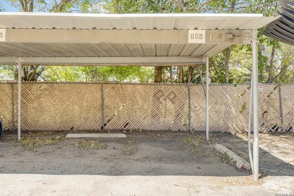 a view of outdoor space with wooden fence