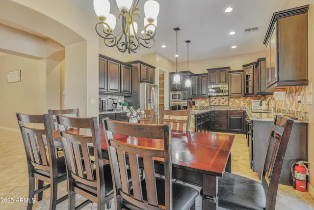 a bedroom with a bed and a flat screen tv on a dresser