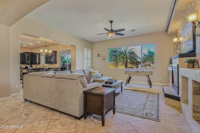 a view of a dining room with furniture wooden floor and chandelier