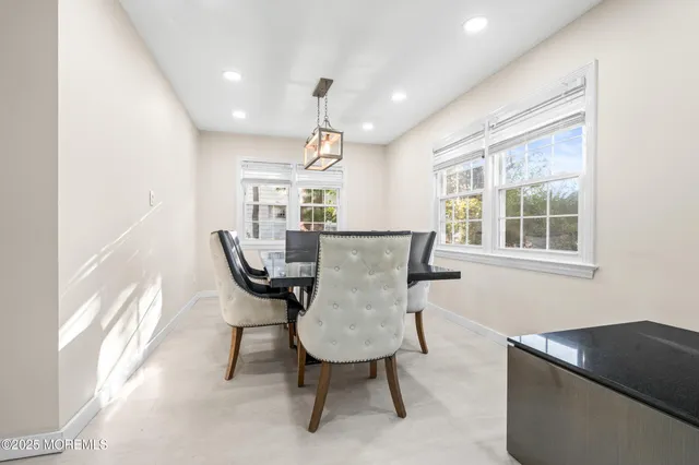 a view of a livingroom with furniture and window