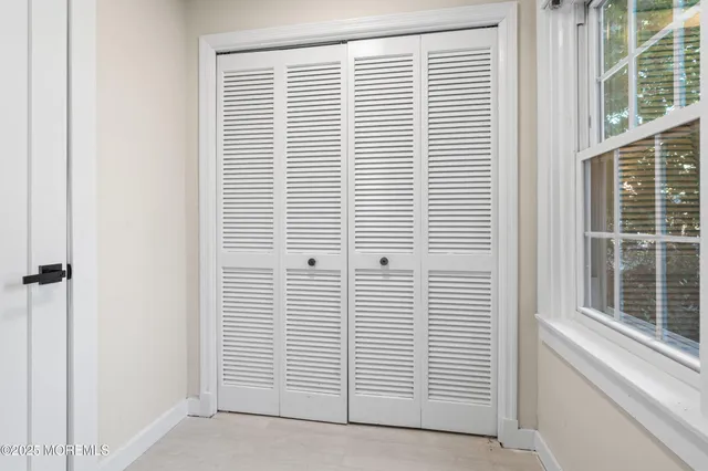 a view of a room with windows