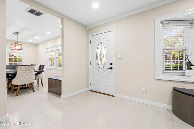 a view of a livingroom with furniture and a window