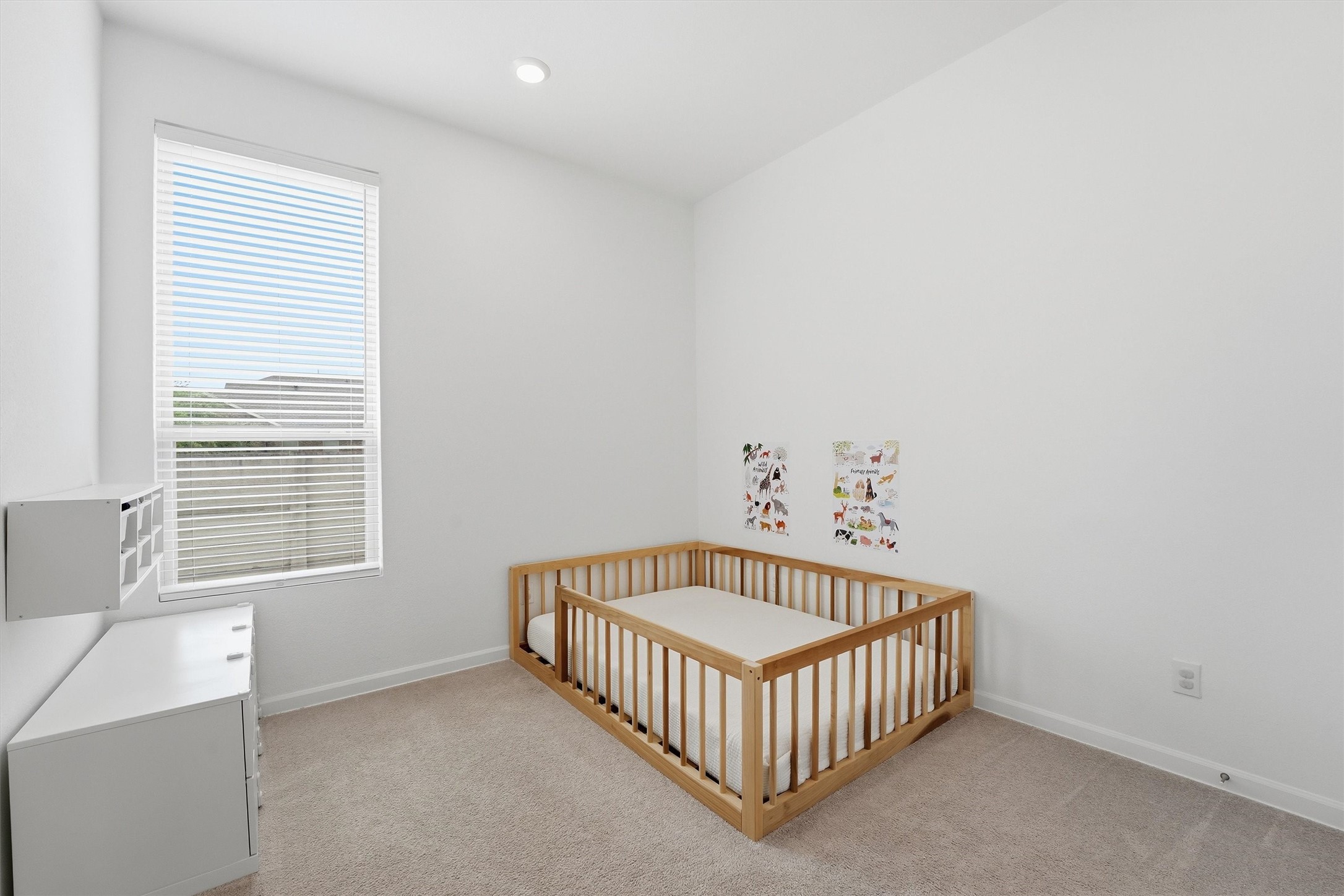 6071 Windward Falls Way Porter, TX 77365 - Photo 8 of 33 Bright and cozy Bedroom with a large window, neutral walls, and soft carpeting.