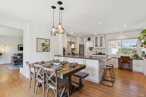 a view of a dining room with furniture window and outside view