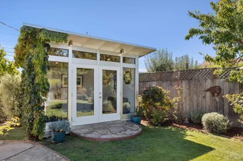 a view of a house with outdoor seating area