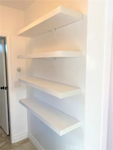 a view of a room with a large window