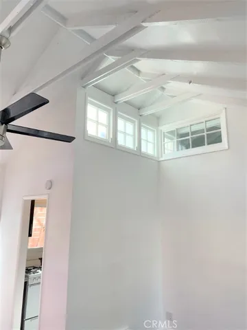 a view of entryway with a window and a ceiling fan