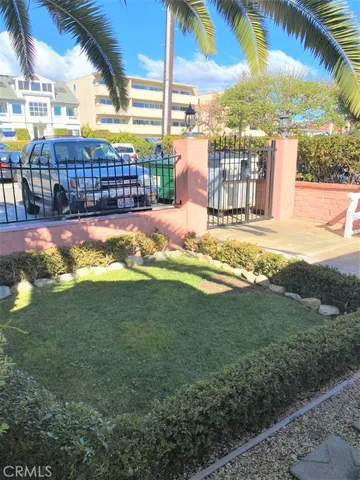 a view of a house with swimming pool and sitting area