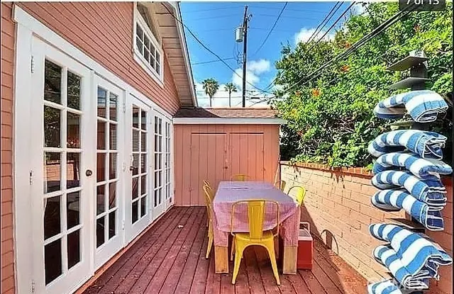 a view of balcony with wooden floor